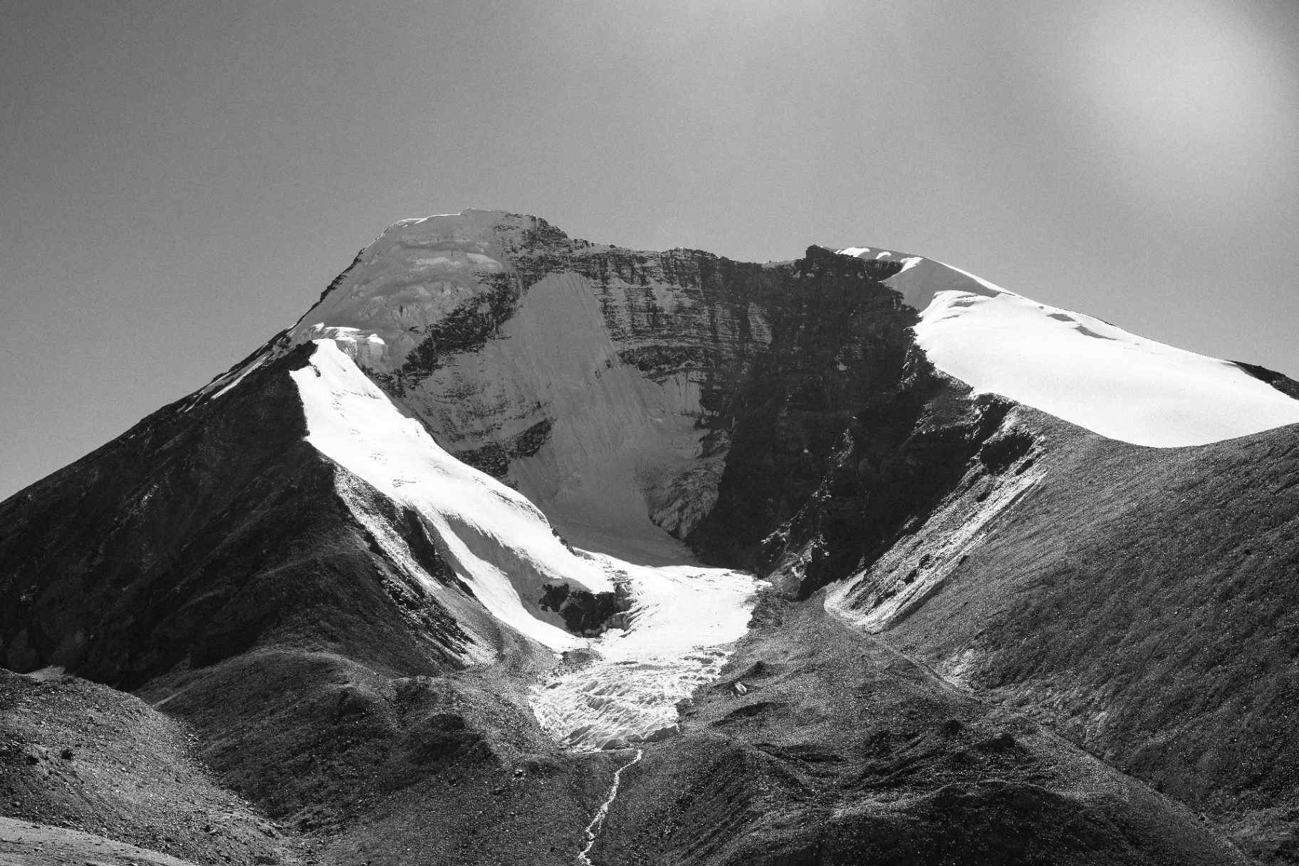 Black and white study of a snow-covered peak and hanging glacier, Ladakh